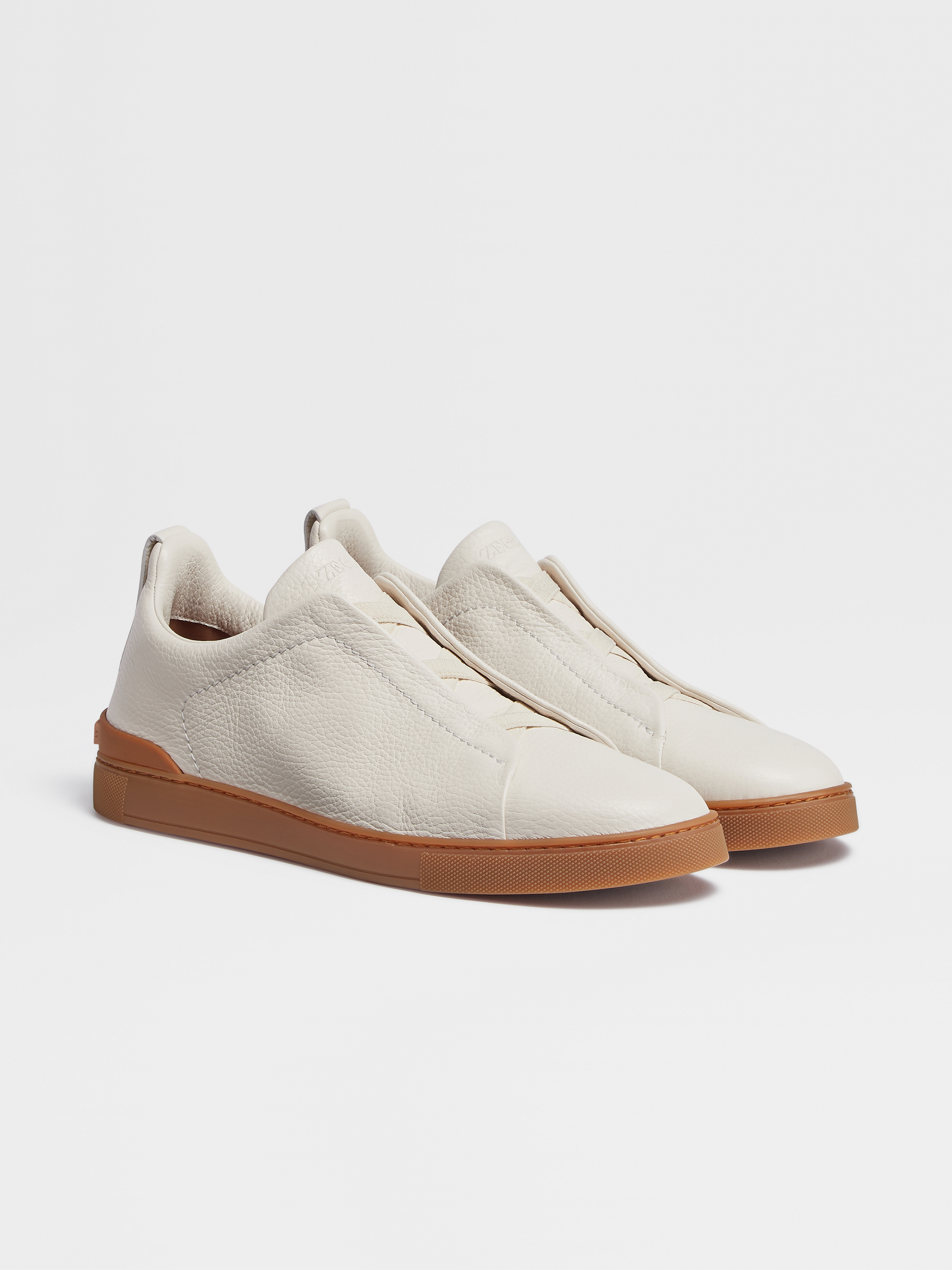 off white deerskin triple stitch sneakers