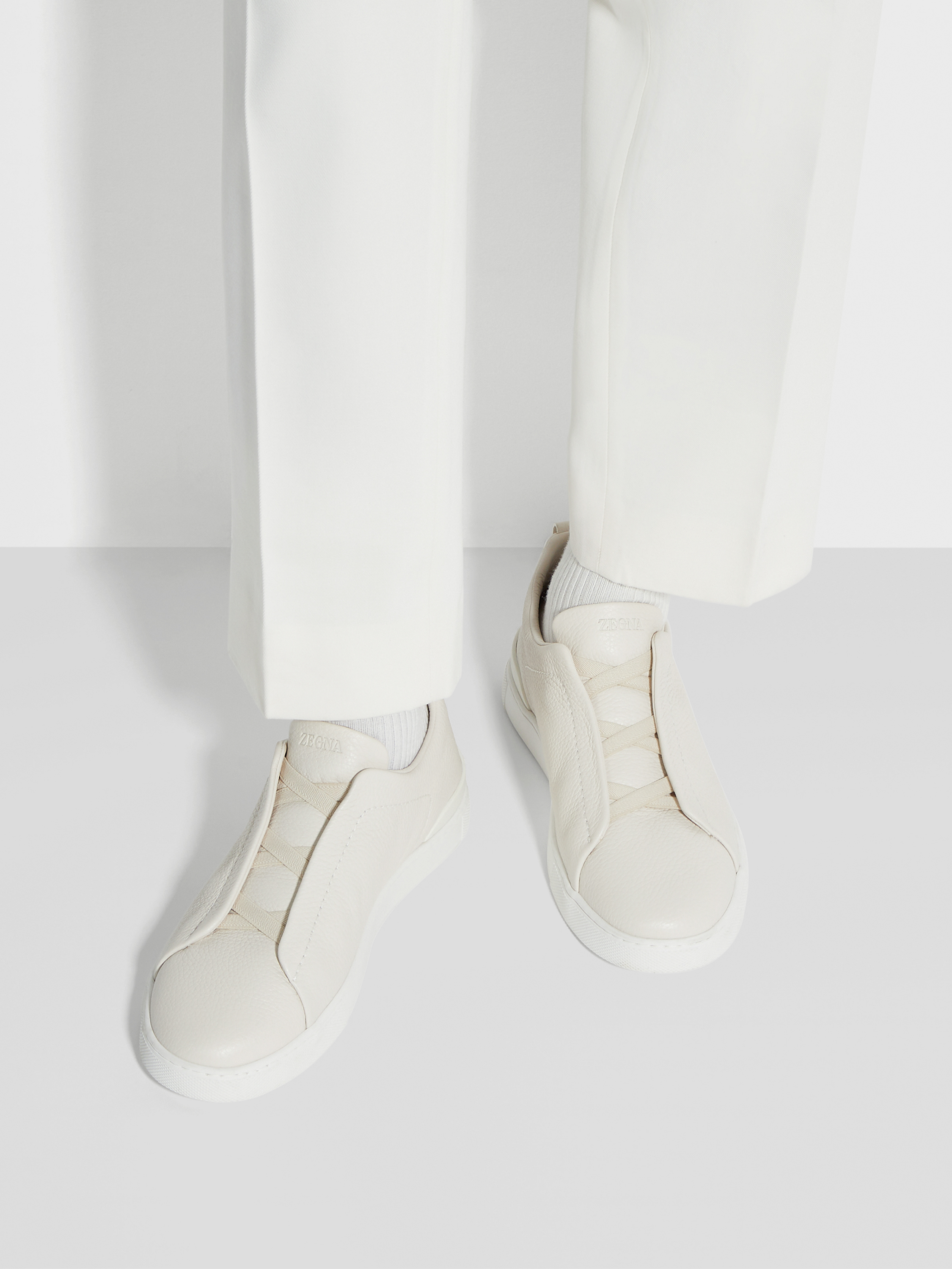 off white deerskin triple stitch sneakers