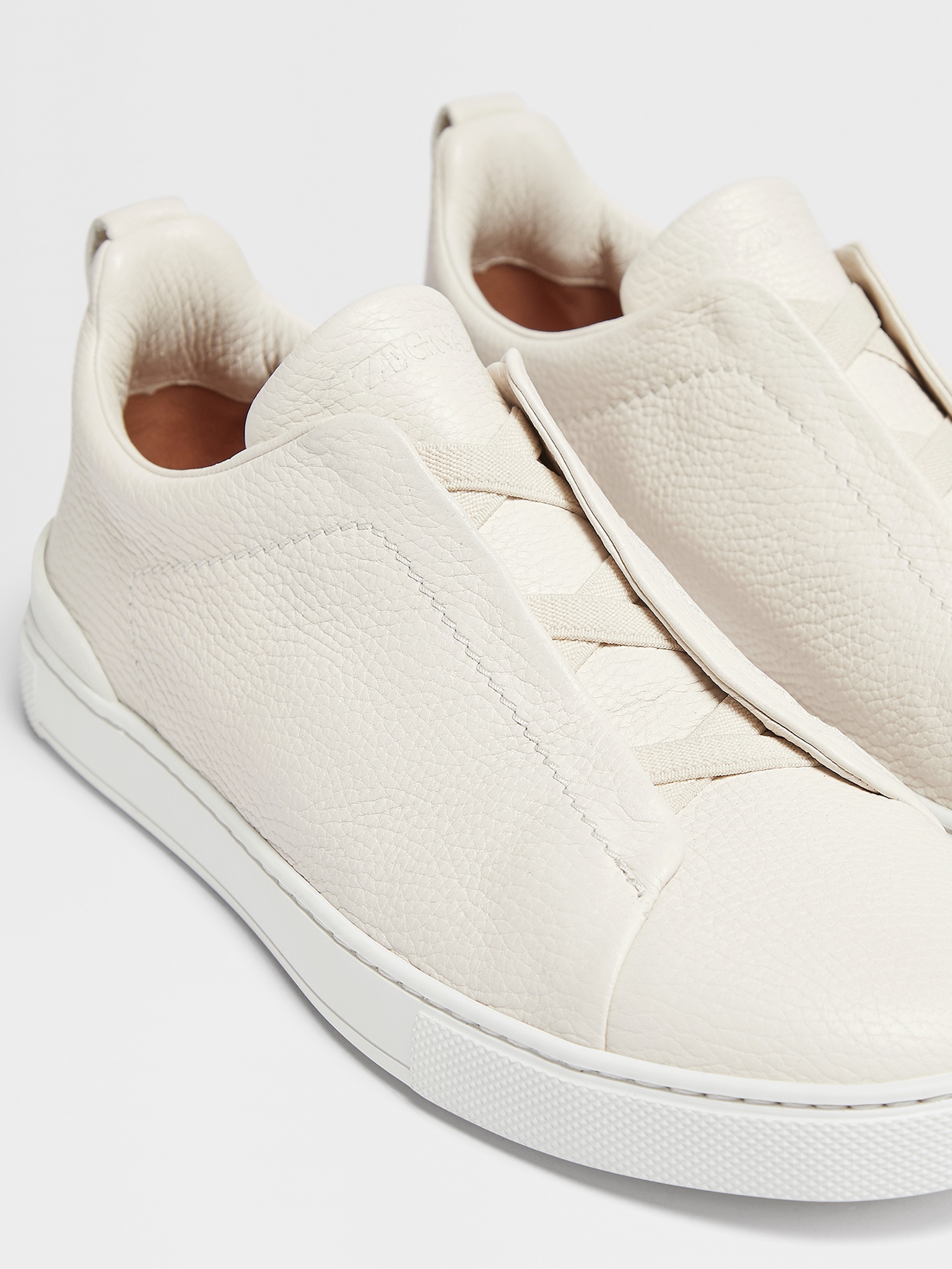 off white deerskin triple stitch sneakers