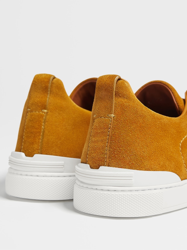 orange and burgundy sneakers