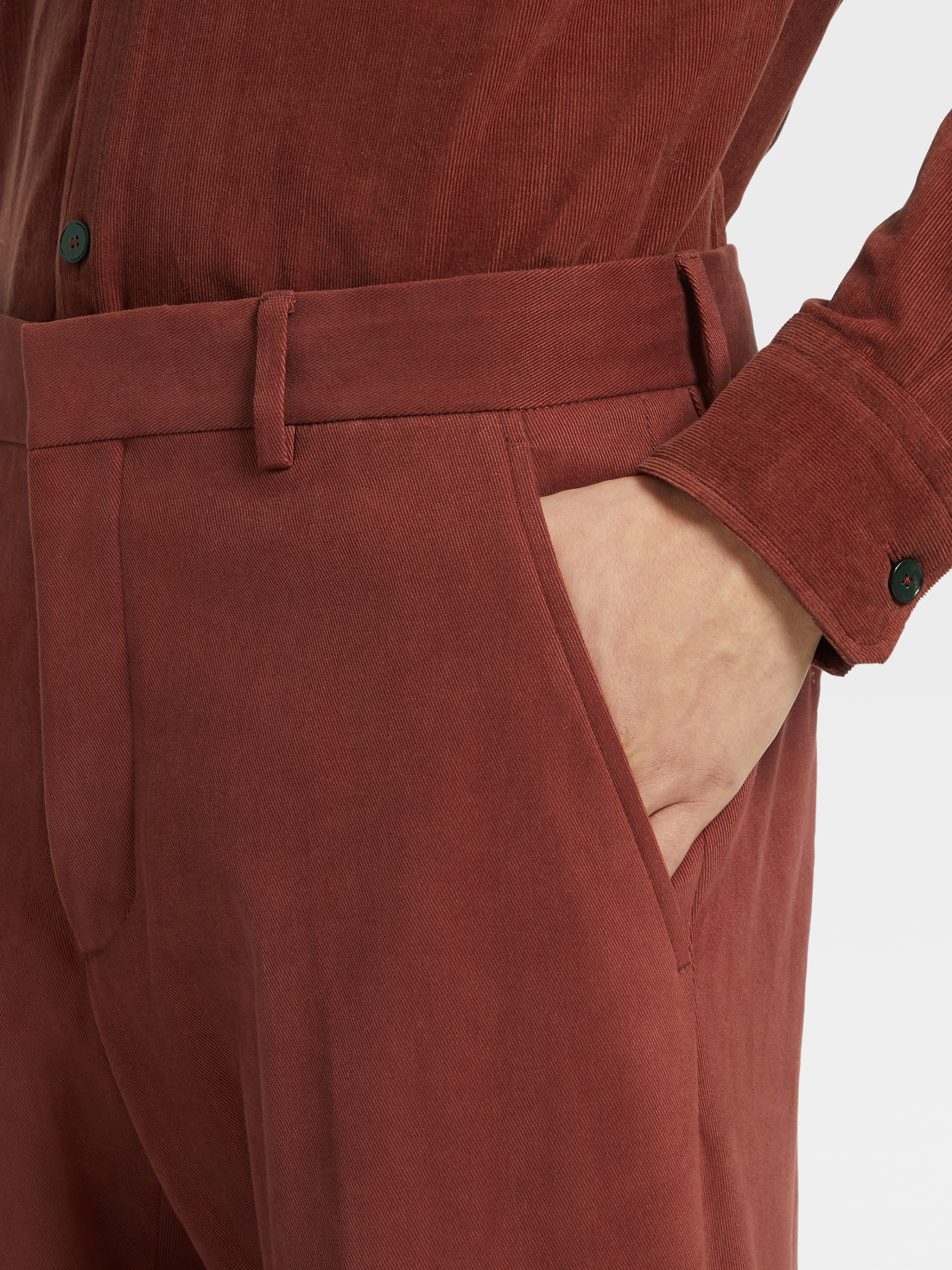 brick red trousers
