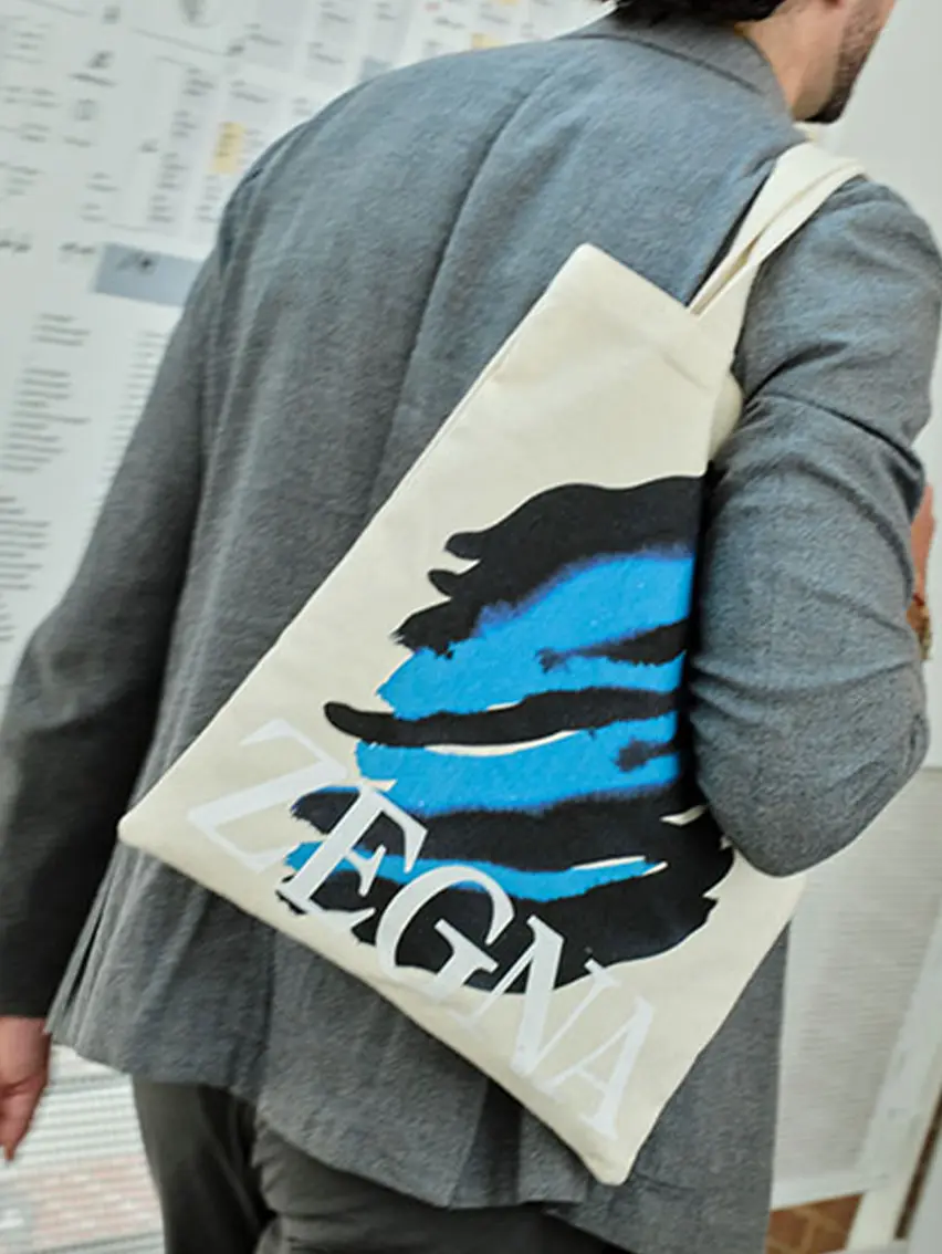 ZEGNA Art Basel tote bag carried by a visitor at the event.