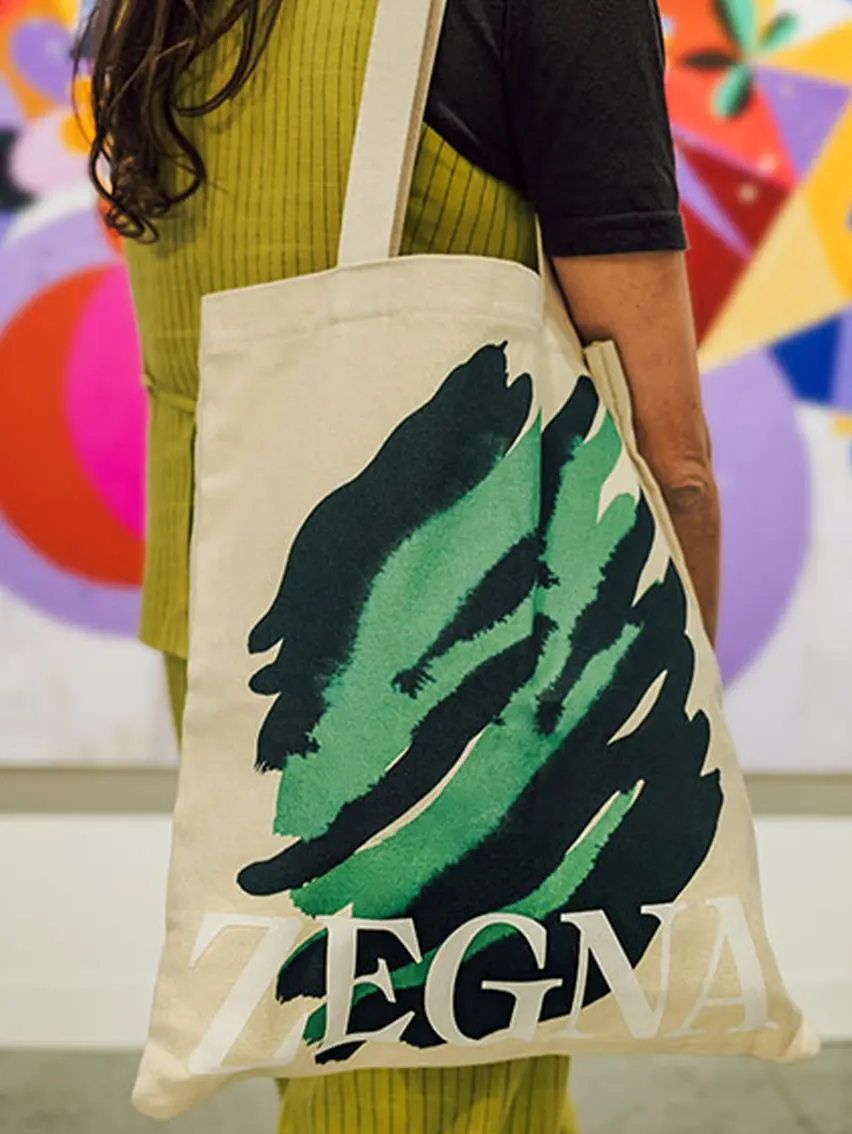 ZEGNA Art Basel tote bag carried by a visitor at the event.
