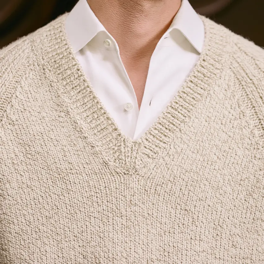 Smart casual menswear look with knitwear and refined pants.