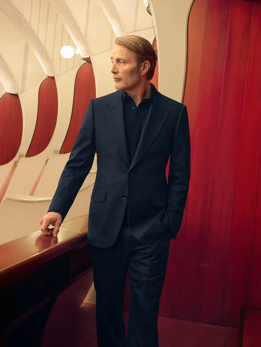 Mads Mikkelsen in an elegant navy suit embodying Italian elegance, from the ZEGNA FW25 collection.