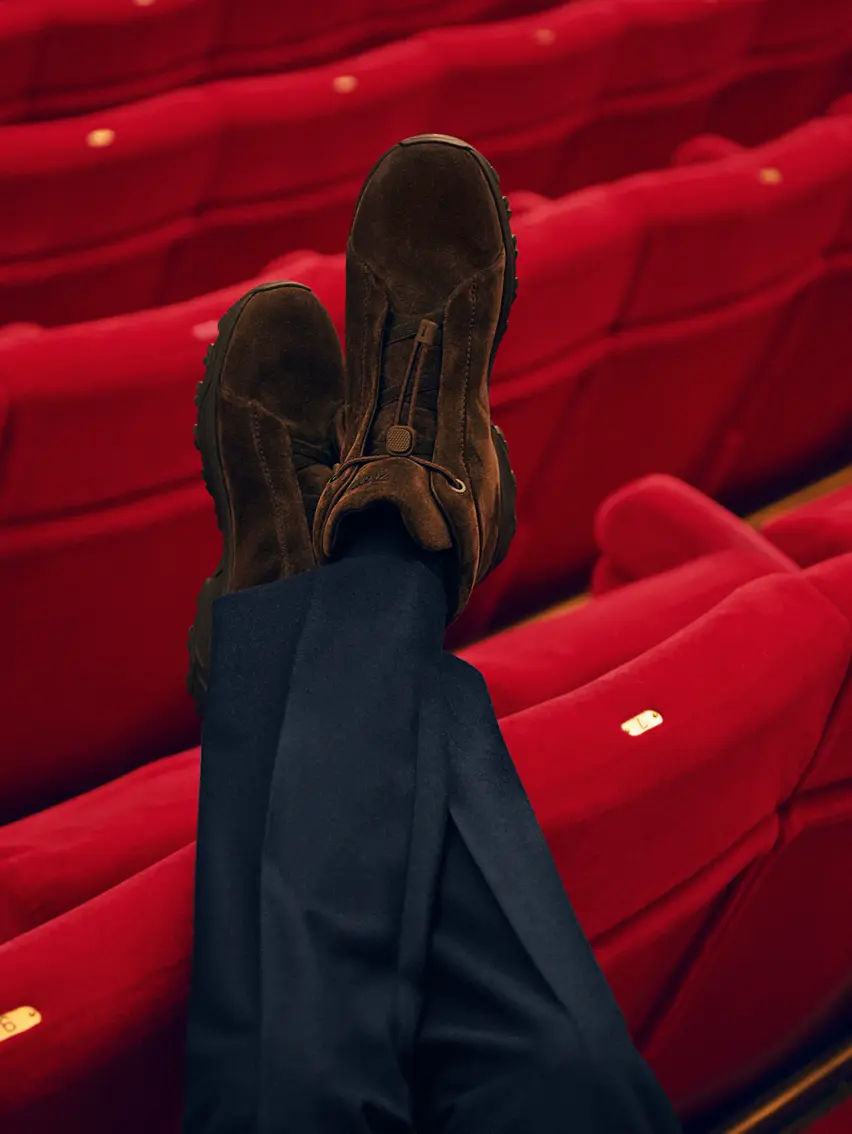 Mads Mikkelsen wearing suede Triple Stitch™ Vetta sneakers at Teatro Regio in Turin, from the ZEGNA FW25 collection.