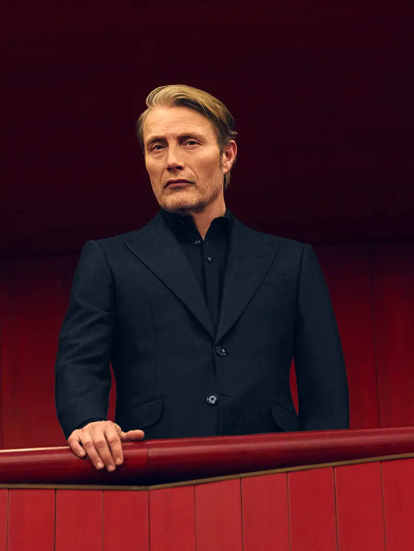 Mads Mikkelsen wearing a dark navy Torino style suit at Teatro Regio, from the ZEGNA Fall/Winter 2025 collection.