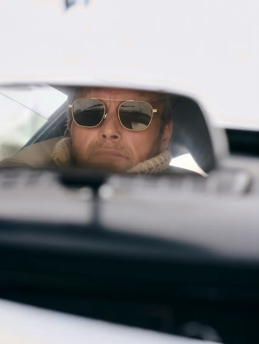 Close-up of Mads Mikkelsen in a ZEGNA winter look featuring sunglasses.