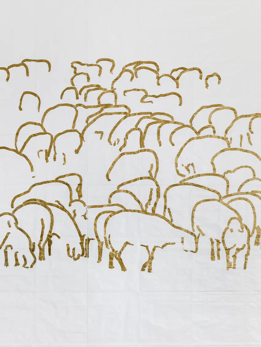 Glowing, translucent resin sheep illuminated from within, placed in a white space.