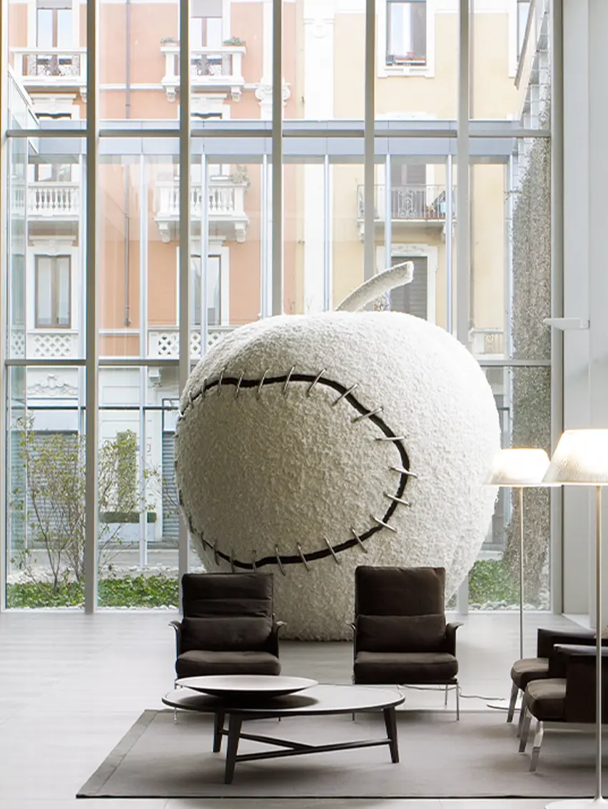 An apple placed inside the ZEGNA global headquarters, created by Michelangelo Pistoletto.