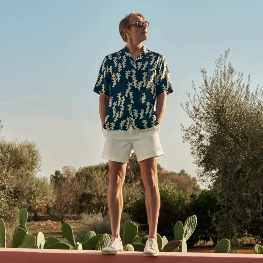 Mads Mikkelsen wearing a refined summer outfit with a linen shirt, swim boxers, and Triple Stitch espadrilles.