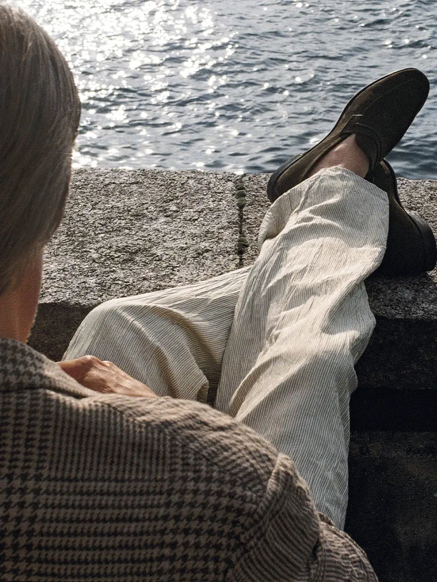 Mads Mikkelsen wearing an elegant ZEGNA Spring Summer 2026 look featuring linen trousers and a linen jacket.
