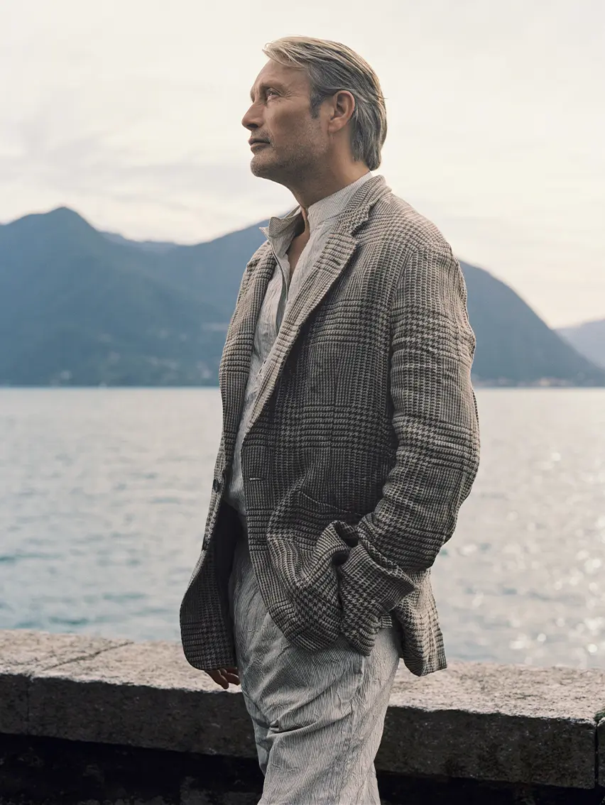 Mads Mikkelsen wearing an elegant ZEGNA Spring Summer 2026 look featuring linen trousers and a linen jacket.