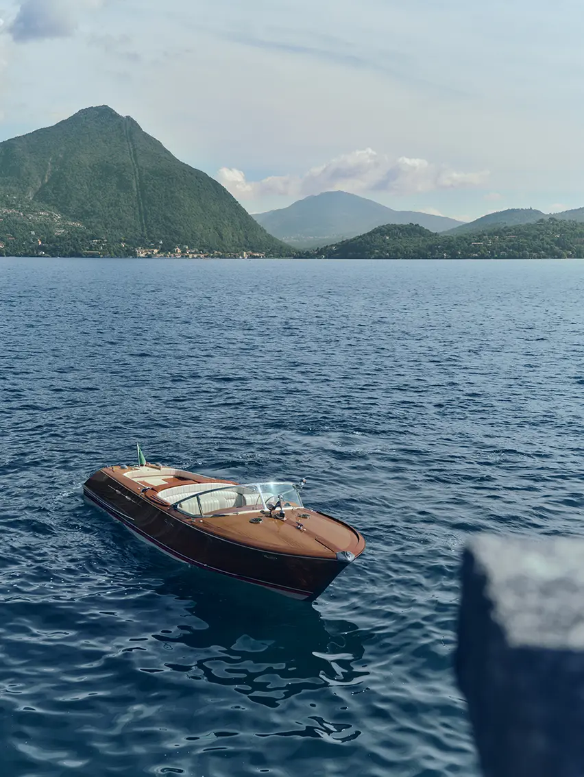Riva Aquarama boat cruising on Lake Maggiore waters.