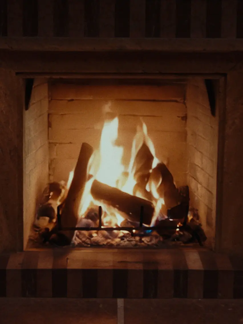 Fireplace detail within an interior, evoking warmth and calm atmosphere file name: interior-fireplace-warm-atmosphere.