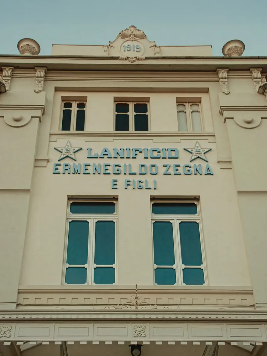 Façade of the Zegna lanificio building, reflecting the brand’s industrial heritage and architectural identity.