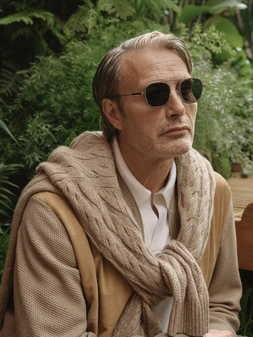 Mads Mikkelsen wearing a cashmere bomber, lightweight knitwear crew neck and sunglasses from the ZEGNA SS26 collection.