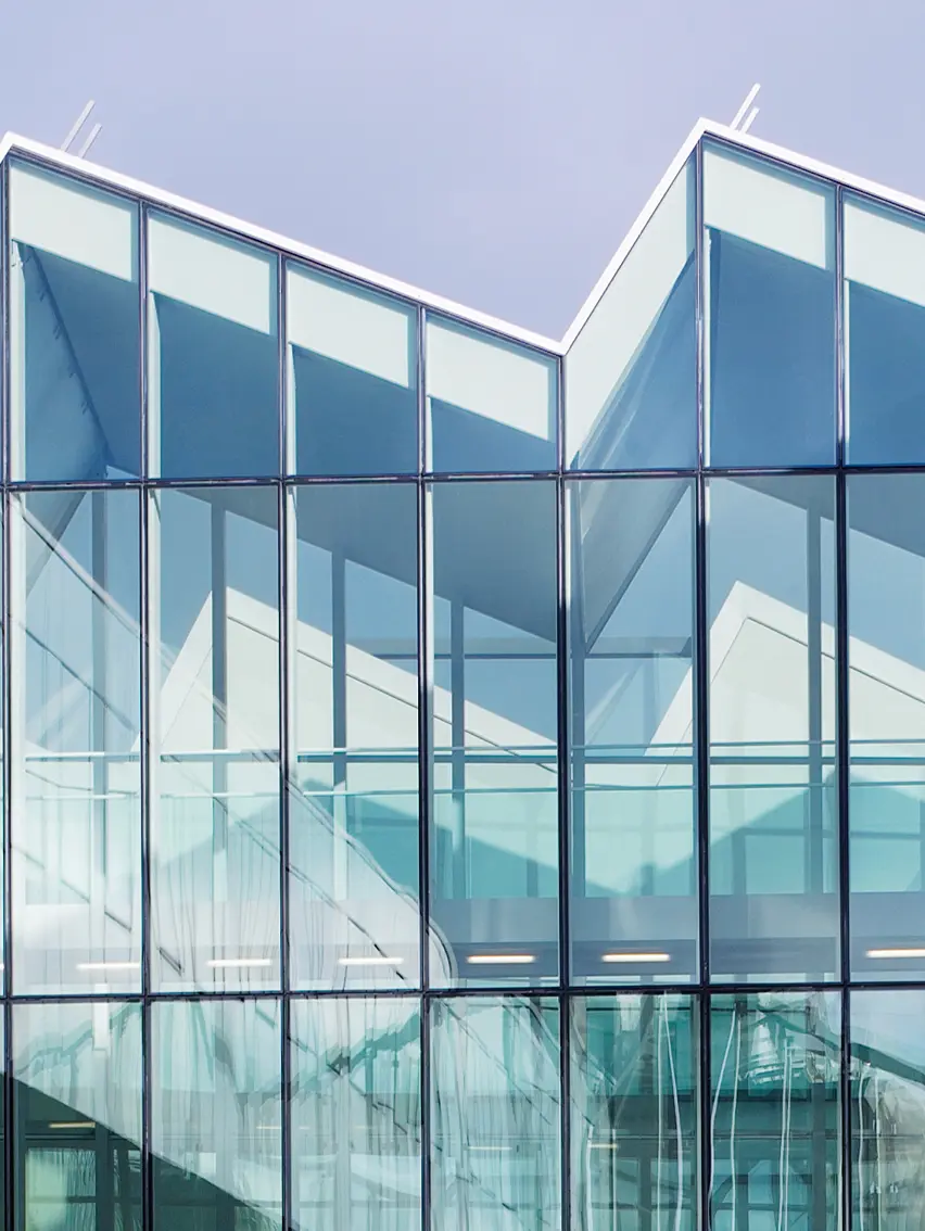 ZEGNA HQ Milan modern glass architecture exterior view showcasing headquarters building design.