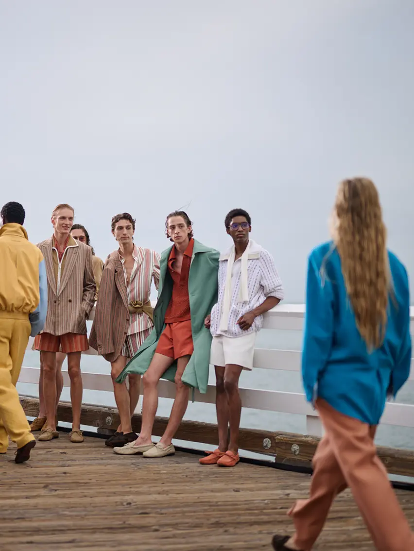 Models looking at other models walking the runway at the ZEGNA Spring/Summer 2027 Fashion Show in LA