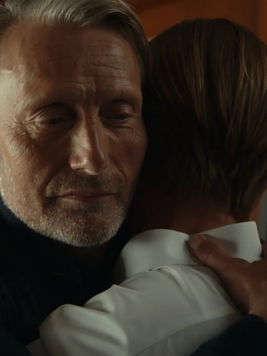 Father and son sharing an embrace.