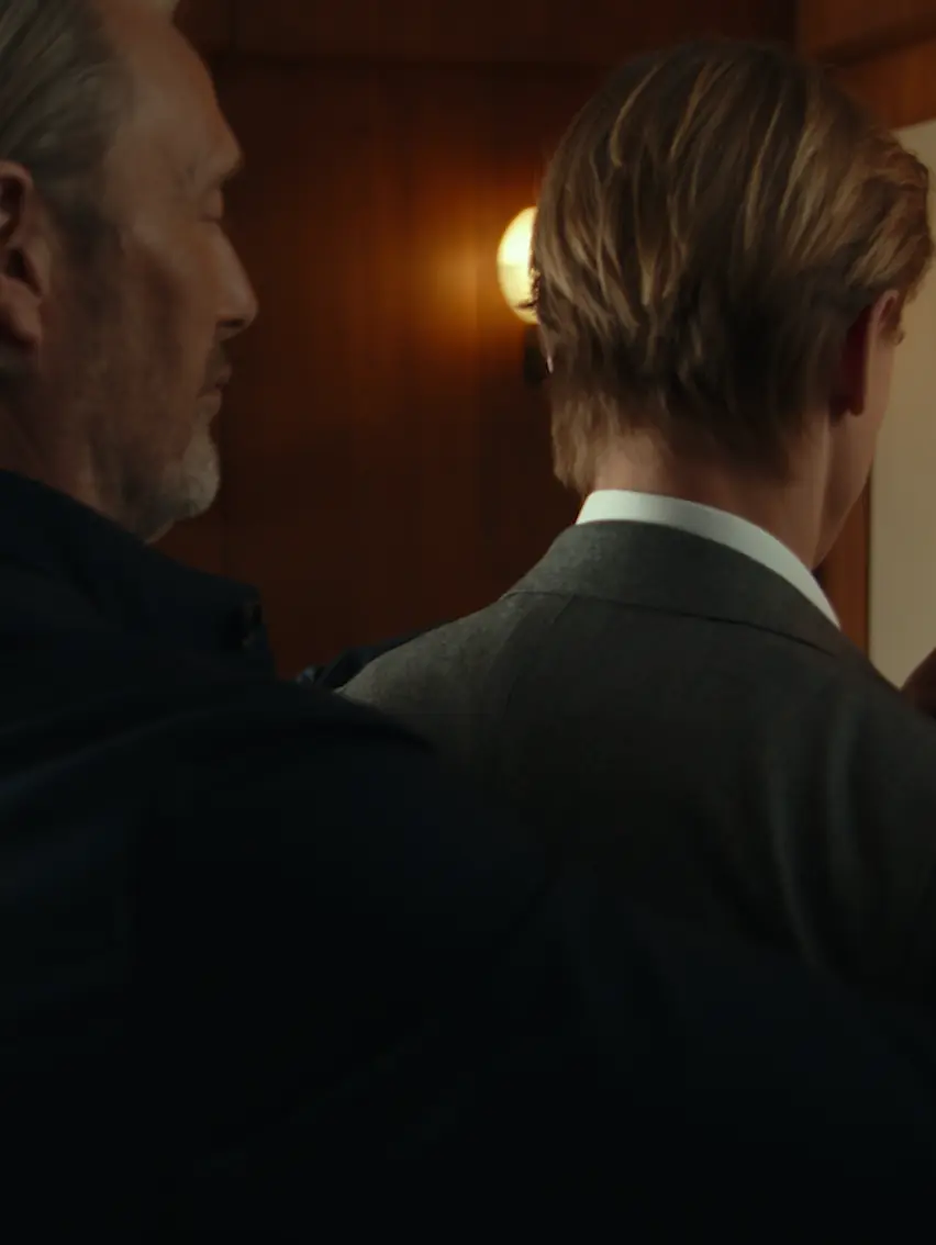 Father and son during a tailoring fitting at a ZEGNA atelier.