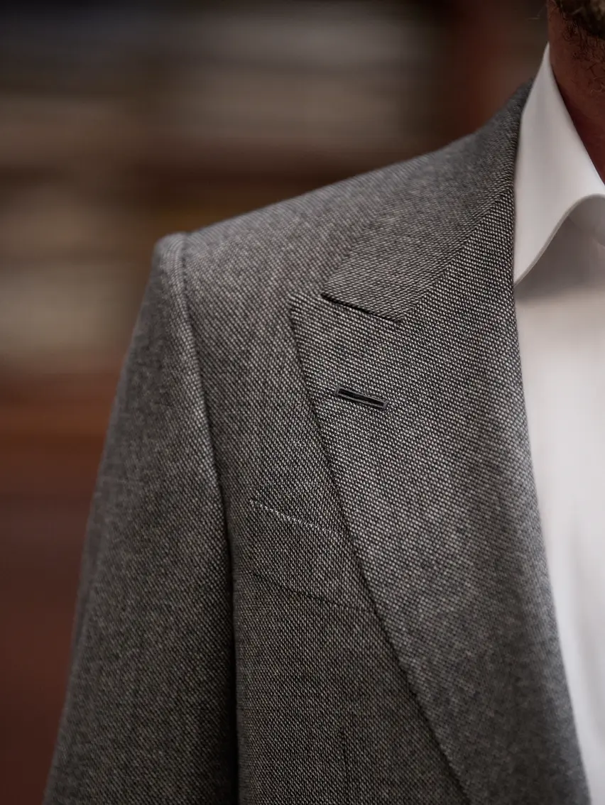 Close up of the lapel of a tailored ZEGNA jacket.