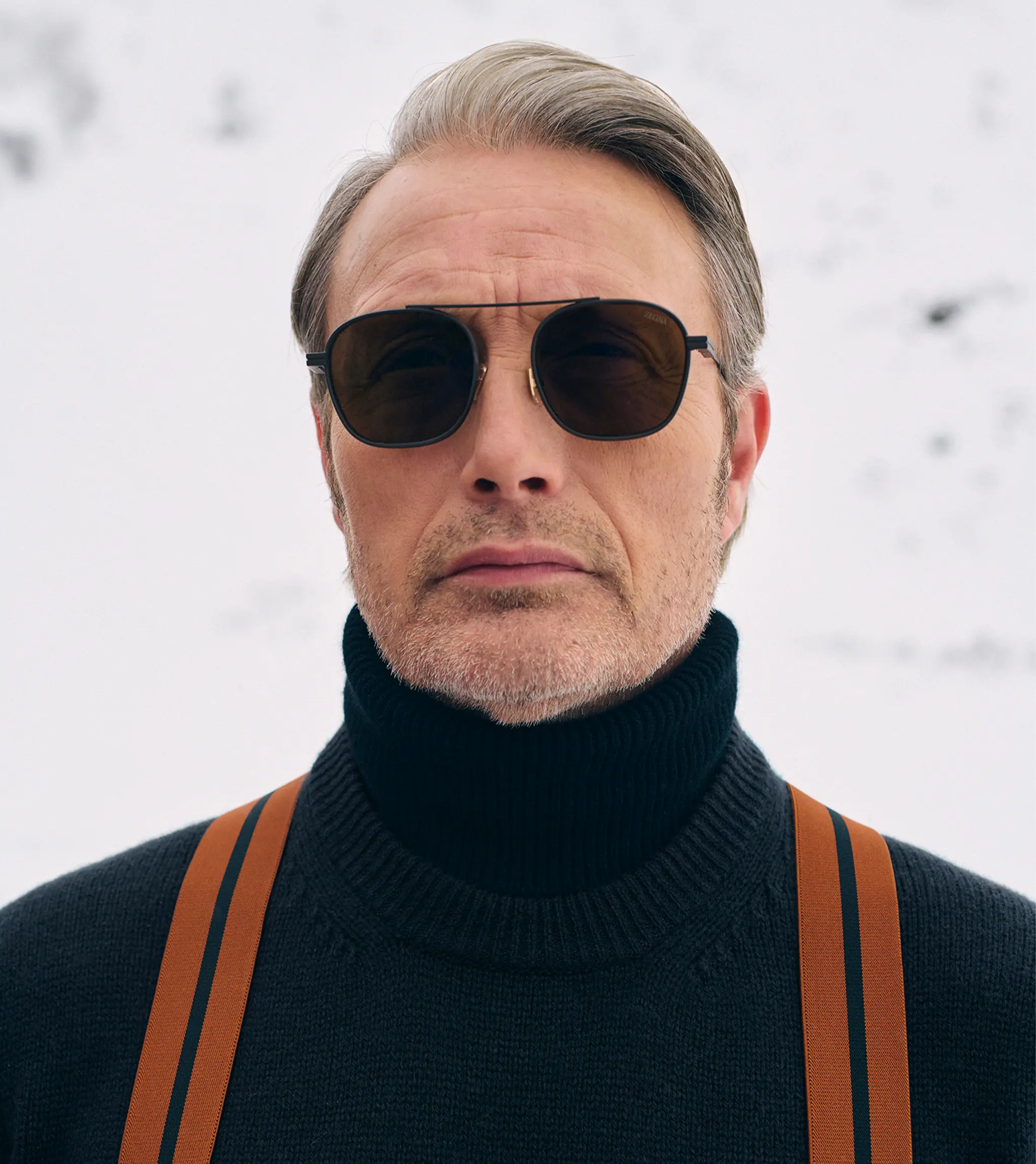 Close-up of Mads Mikkelsen in a ZEGNA winter look featuring knitwear.