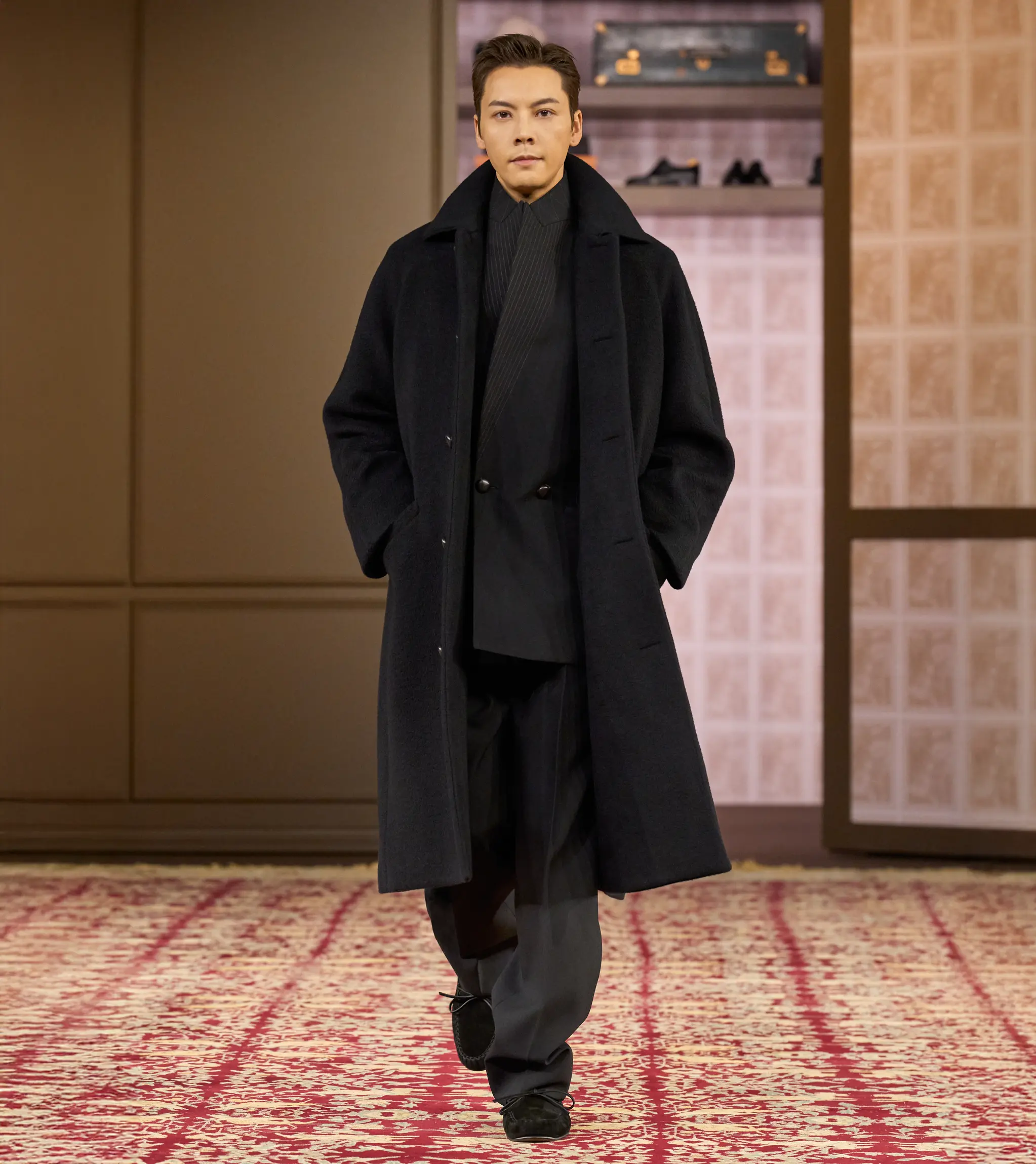 William Chan wearing a ZEGNA winter look on the runway at the ZEGNA Winter Fashion Show 2026.