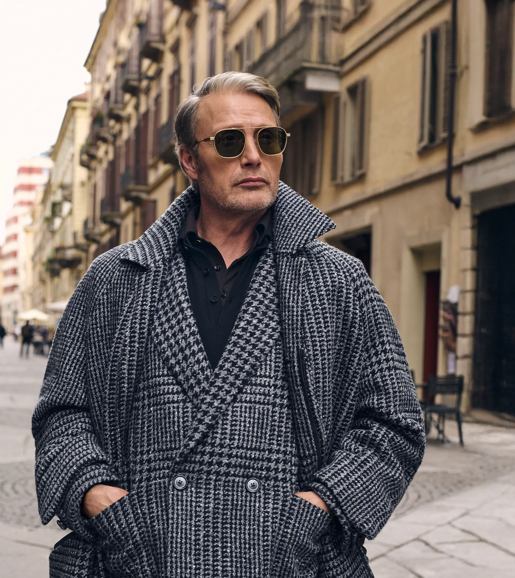 Mads Mikkelsen wearing a coordinated houndstooth coat and blazer in Torino style, from the ZEGNA FW25 collection.
