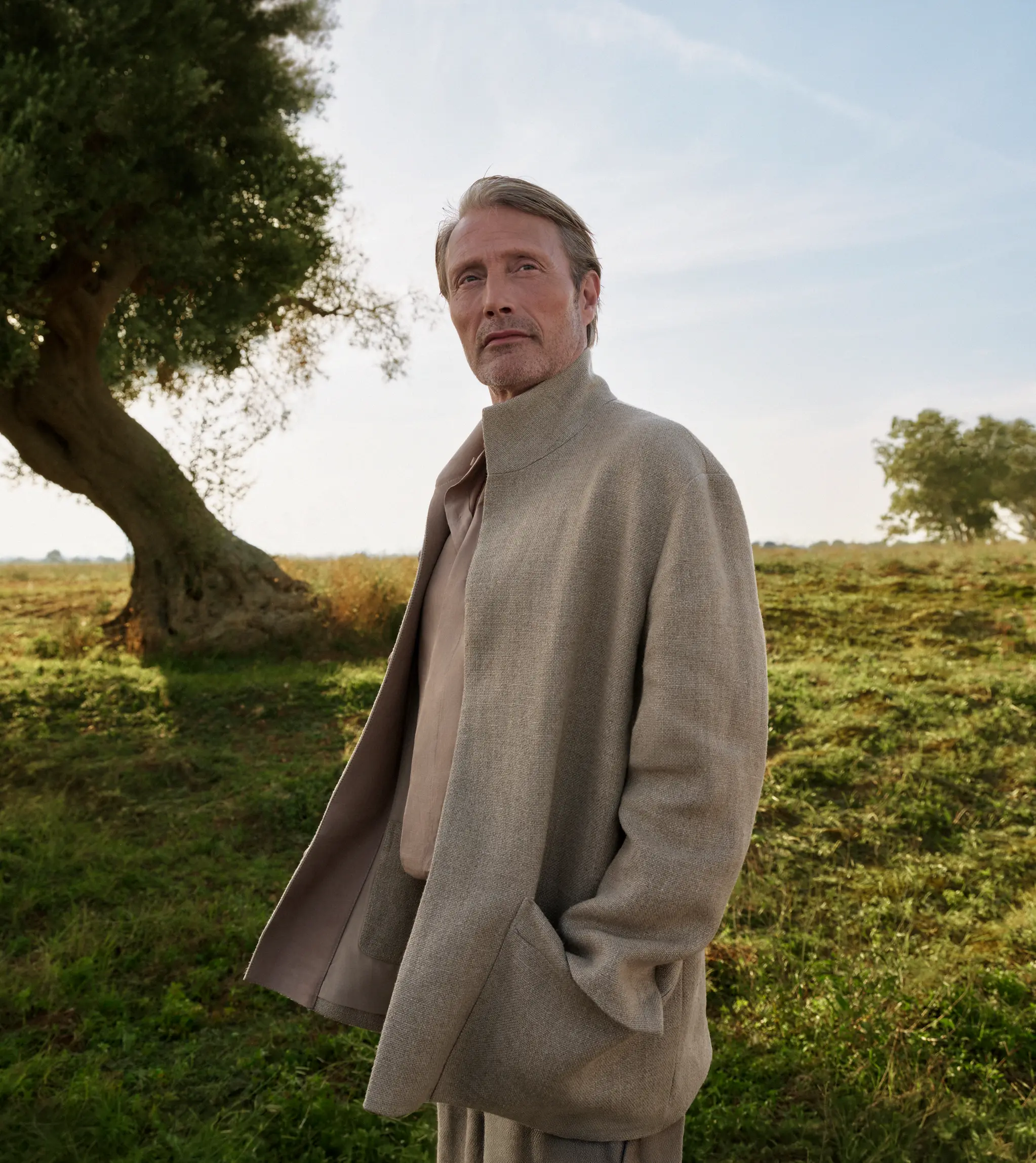 Mads Mikkelsen wearing a tailored outfit with a coat from the ZEGNA Spring/Summer 2025 collection.