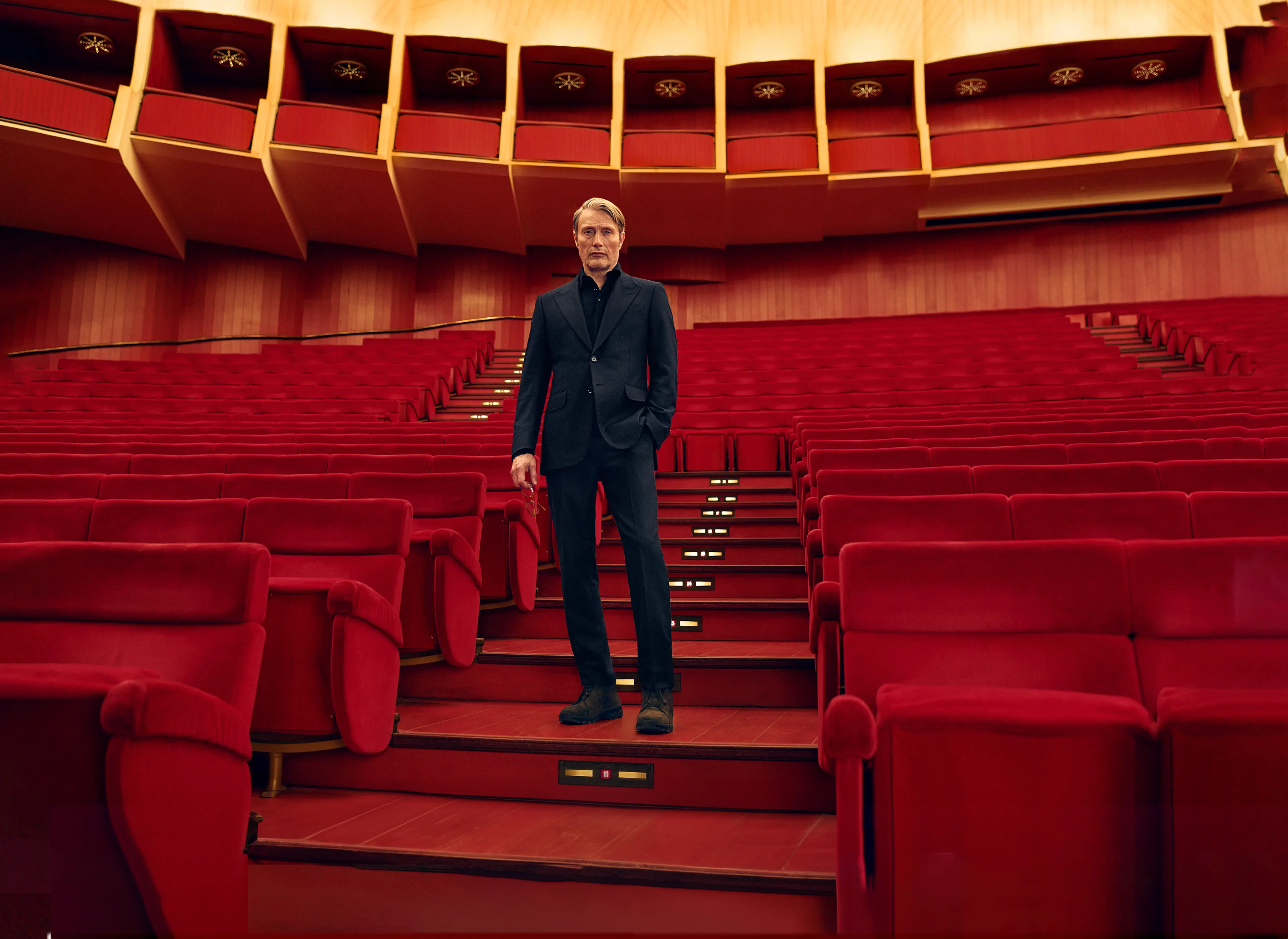 Mads Mikkelsen wearing a dark navy Torino style suit at Teatro Regio, from the ZEGNA Fall/Winter 2025 collection.