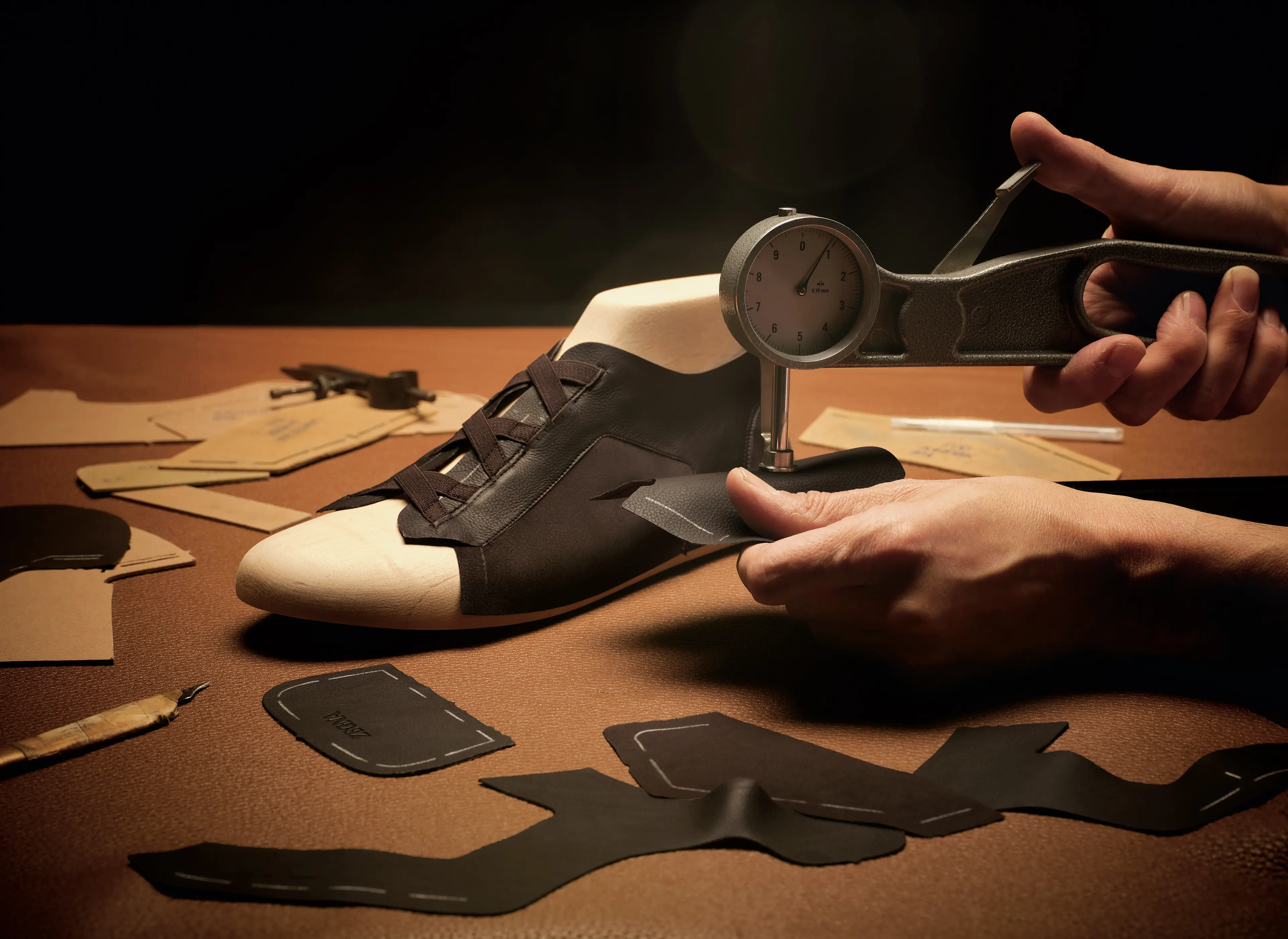 ZEGNA artisan crafting Triple Stitch™ sneakers with SECONDSKIN leather.