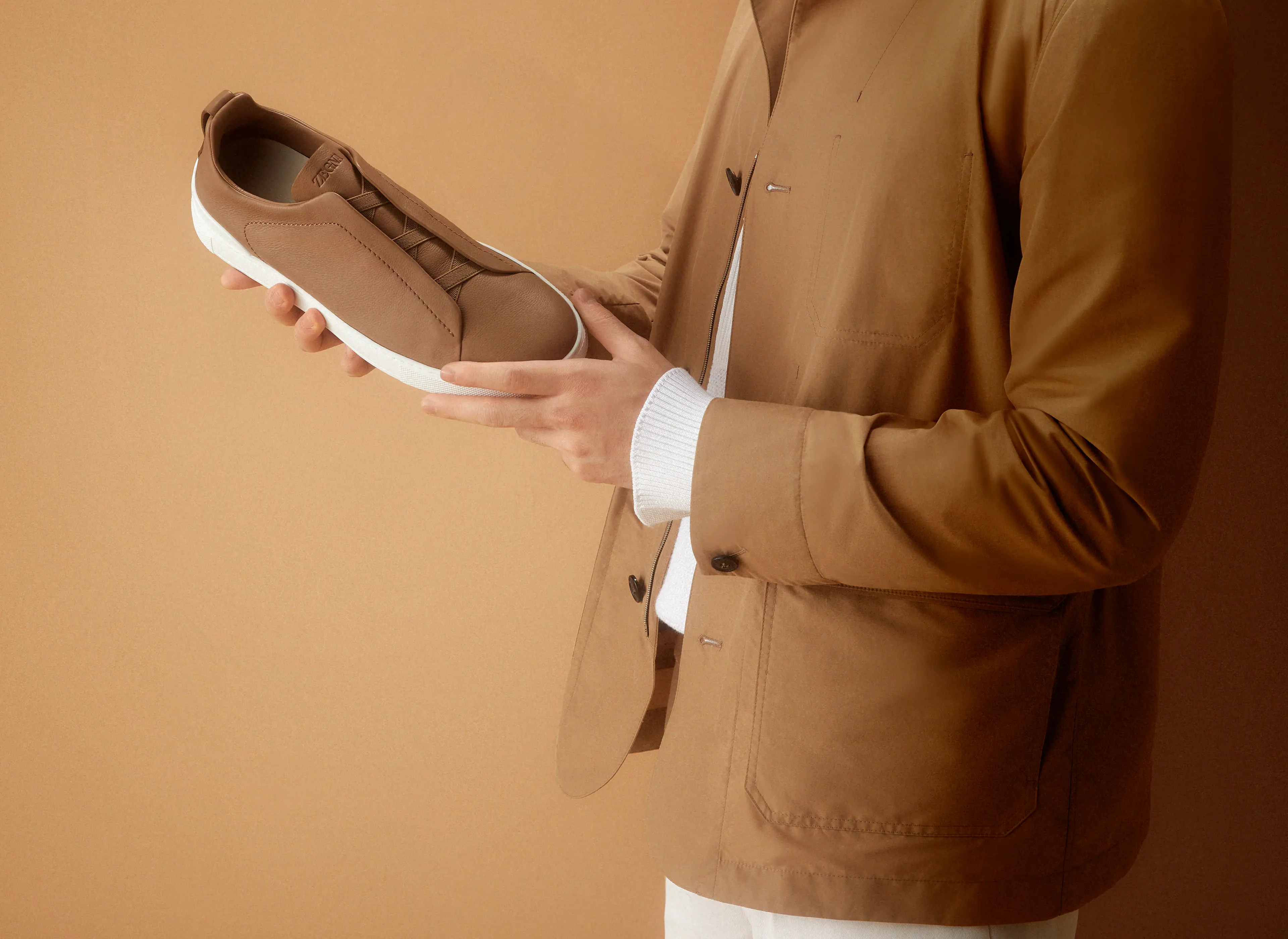Wu Lei, ZEGNA global ambassador, featured in a video describing the craftsmanship and unique features of the new Triple Stitch SECONDSKIN leather sneakers.