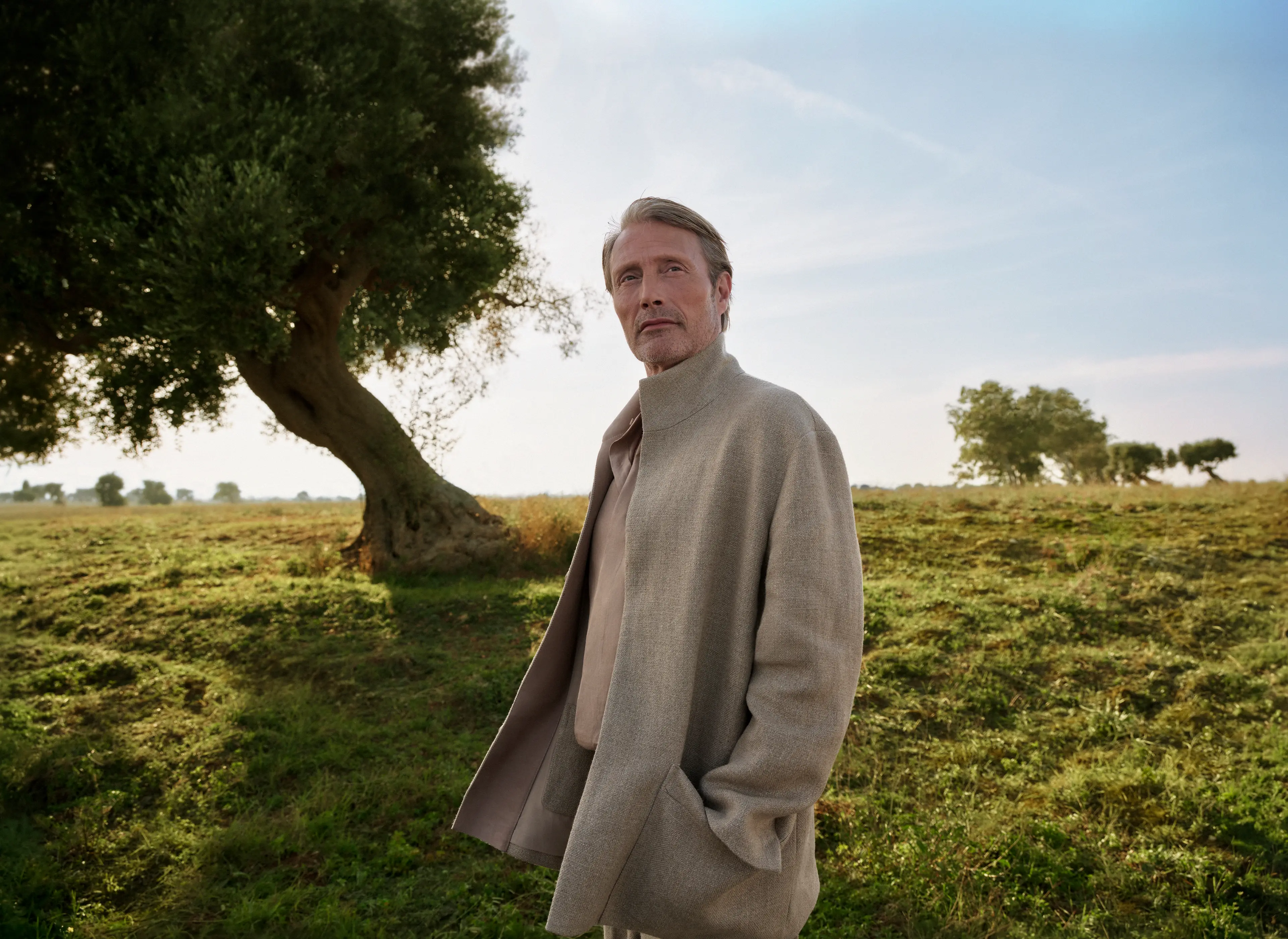 Mads Mikkelsen wearing a tailored outfit with a coat from the ZEGNA Spring/Summer 2025 collection.