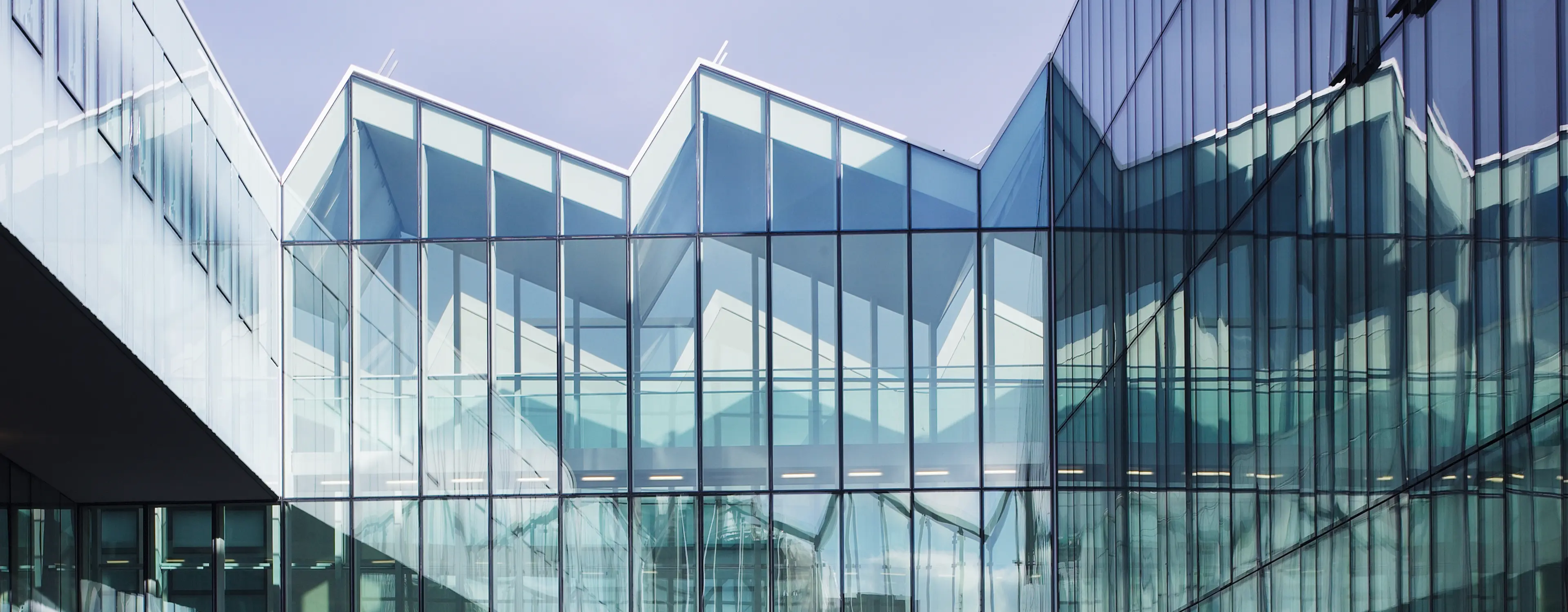 ZEGNA HQ Milan modern glass architecture exterior view showcasing headquarters building design.
