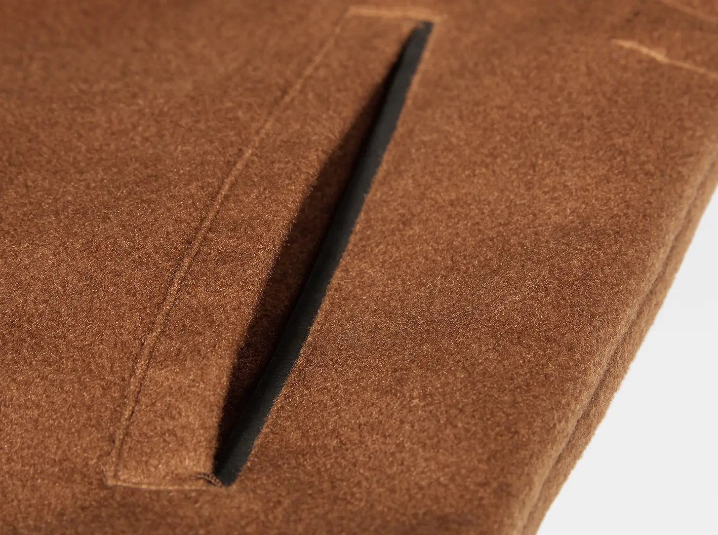 Leather trim finishes off the welt pockets.
