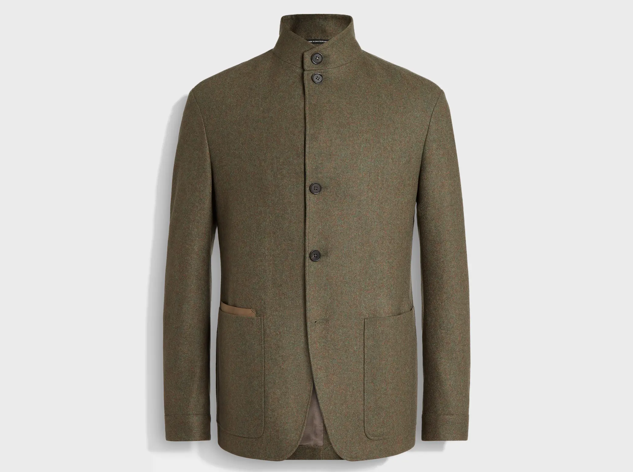 The Il Conte men's jacket by ZEGNA in olive green cashmere, with a high collar, four buttons, and two large front pockets.