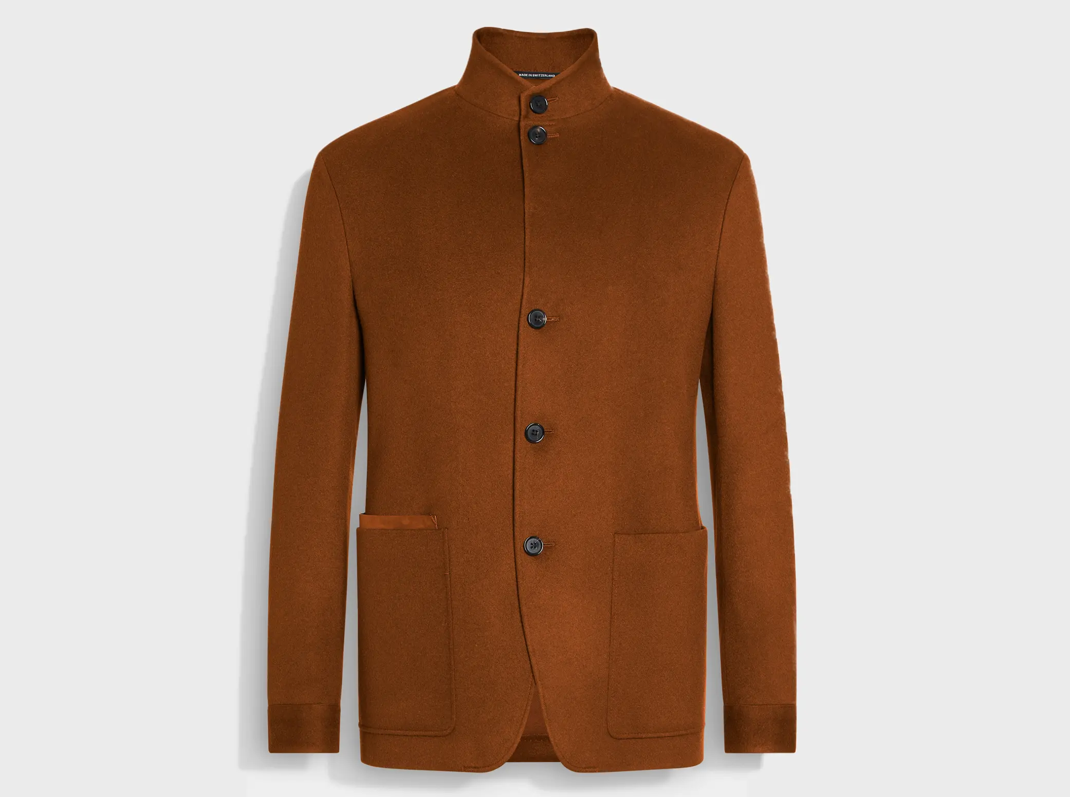Il Conte men's jacket by ZEGNA in terracotta, with a high collar, four buttons, and two large front pockets.